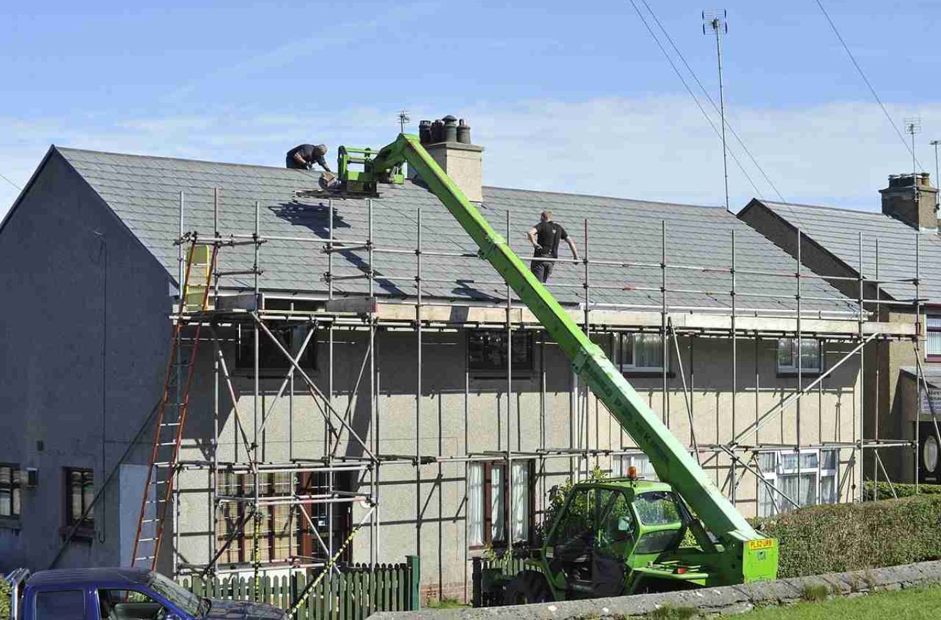 A Kodiak Roofing team working on a roof replacement in McCall, ID, highlighting energy efficiency and enhanced home protection.