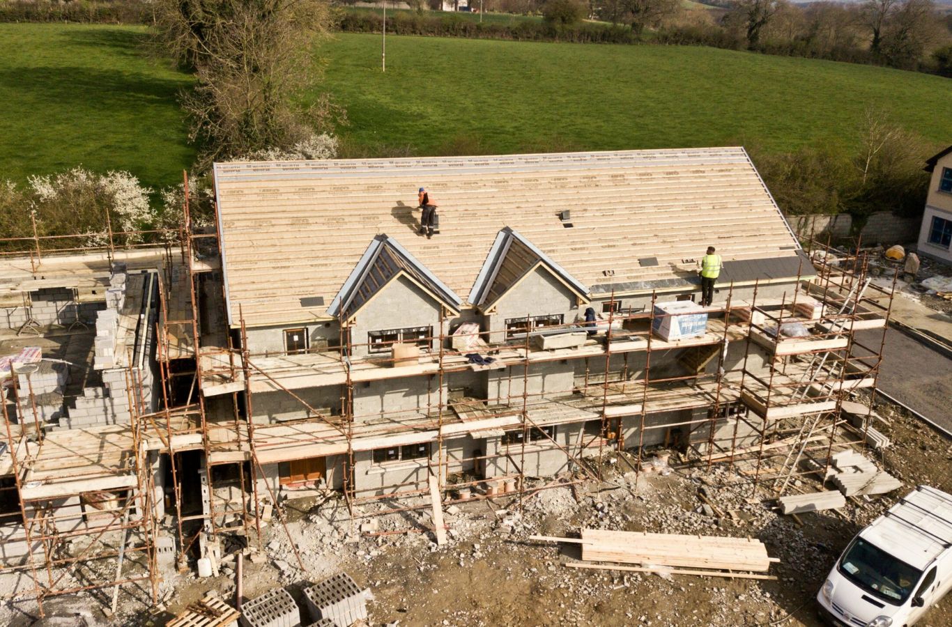 A Kodiak Roofing crew installing a new roof in Caldwell, ID, showcasing the benefits of durability, energy efficiency, and enhanced home value.