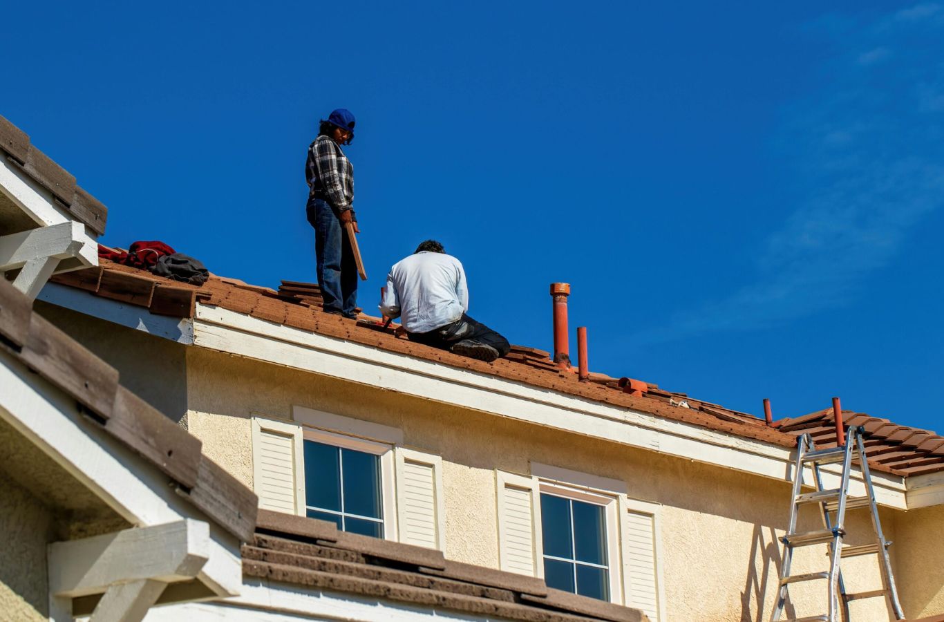 A Kodiak Roofing expert carefully installing a high-quality new roof in Nampa, ID, ensuring superior craftsmanship and protection.